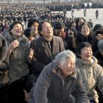 North Koreans cry in front of the Statue of the Sun in Pyongyang in this picture released by the North’s official KCNA news agency