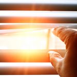 View of sunlight through blinders