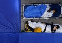 Covid-19 felaketi; Hong Kong’da hastalarla, yaşamını yitirenlerle aynı odada