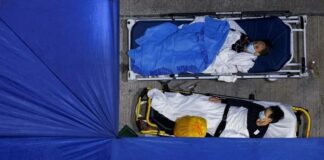 Covid-19 felaketi; Hong Kong’da hastalarla, yaşamını yitirenlerle aynı odada