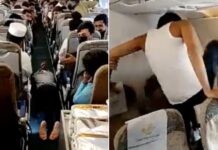 Kırmak için uçağın camını tekmeleyerek panik yarattı